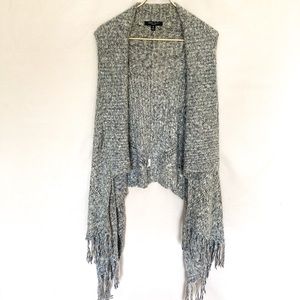 Blue knit sweater vest with fringe